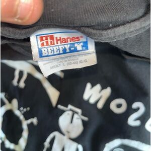 A piece of art on  a black T what can’t you get when it comes to vintage